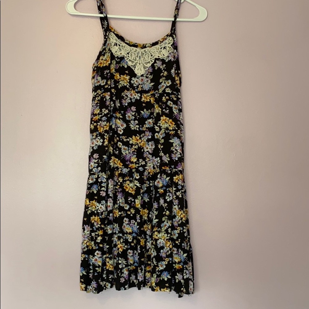 A black floral tie back dress